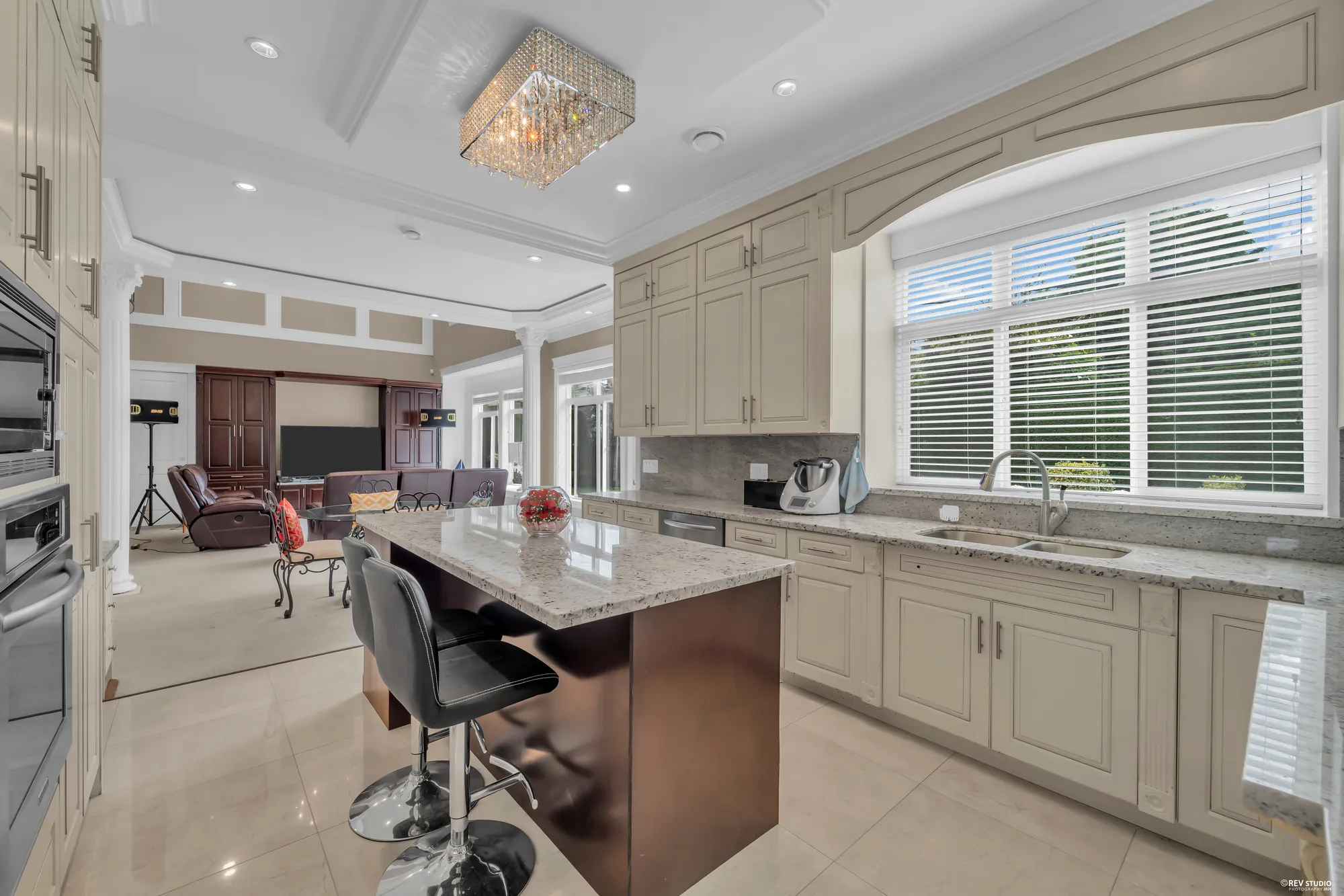 From the island to the family room, the sink under the window at right