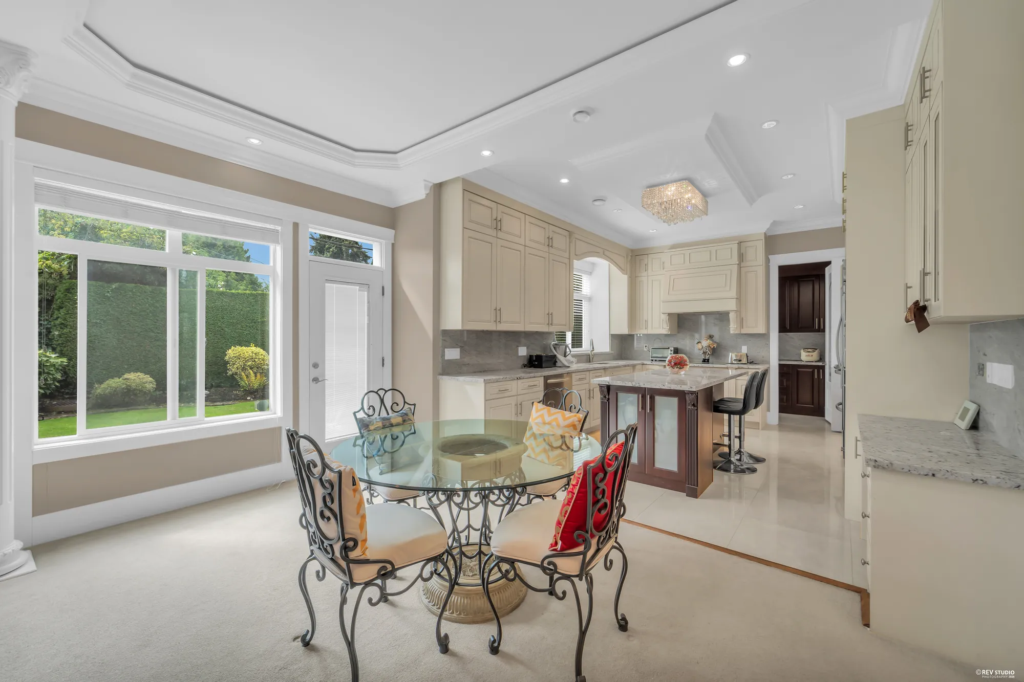 The nook's table and the kitchen island beyond